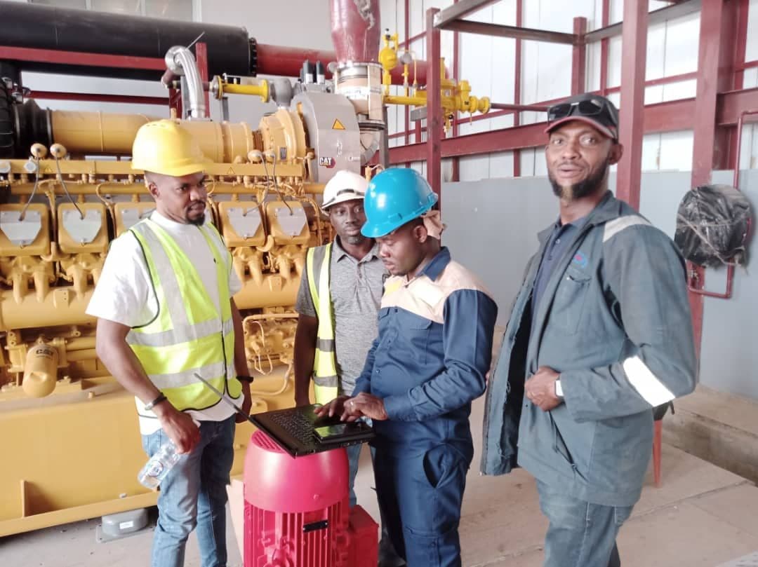 Lobcom engineers reviewing a gas engine generator on the Ekiti IPP