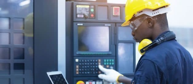 Lobcom technician at an industrial control panel