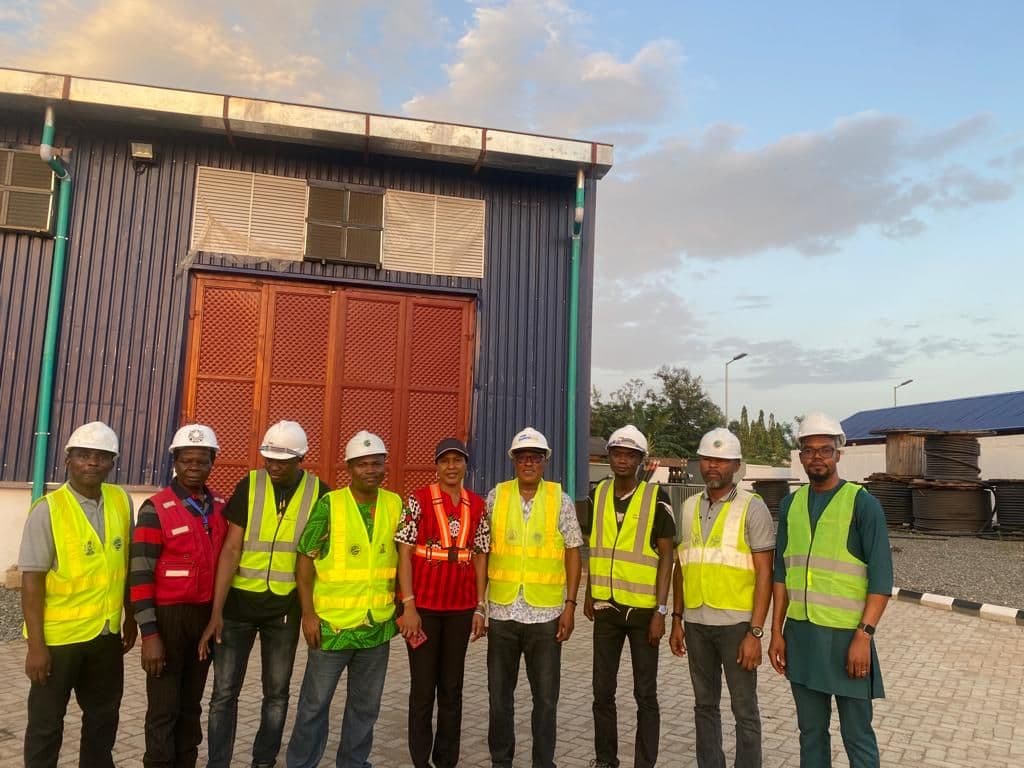 The Lobcom project team outside the Ekiti power station